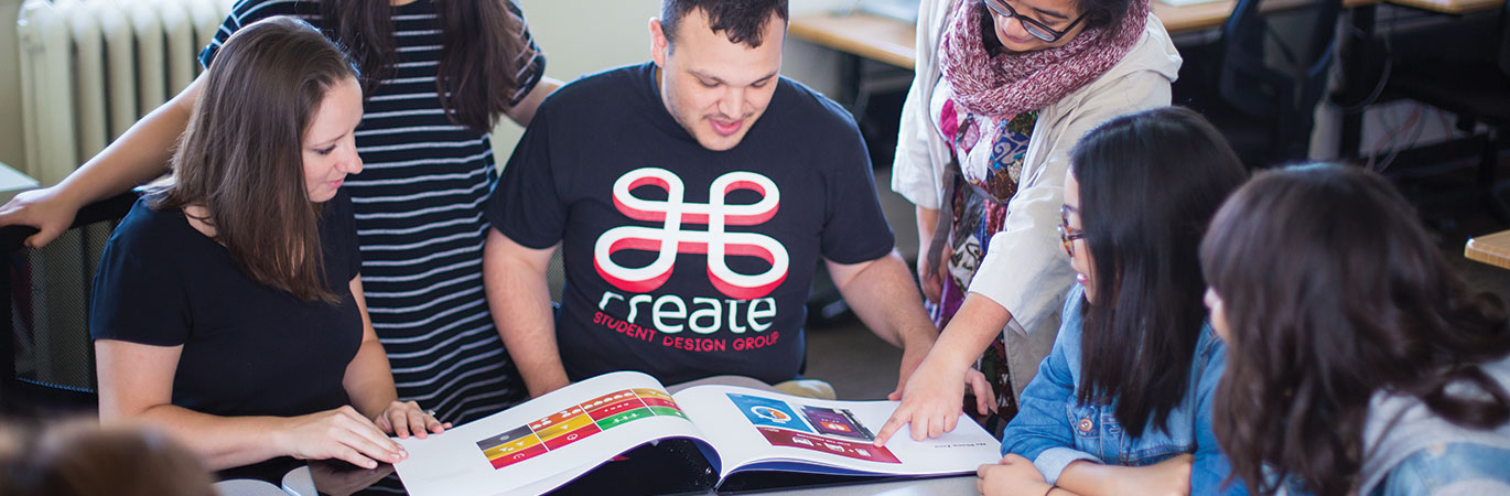 Students looking at book