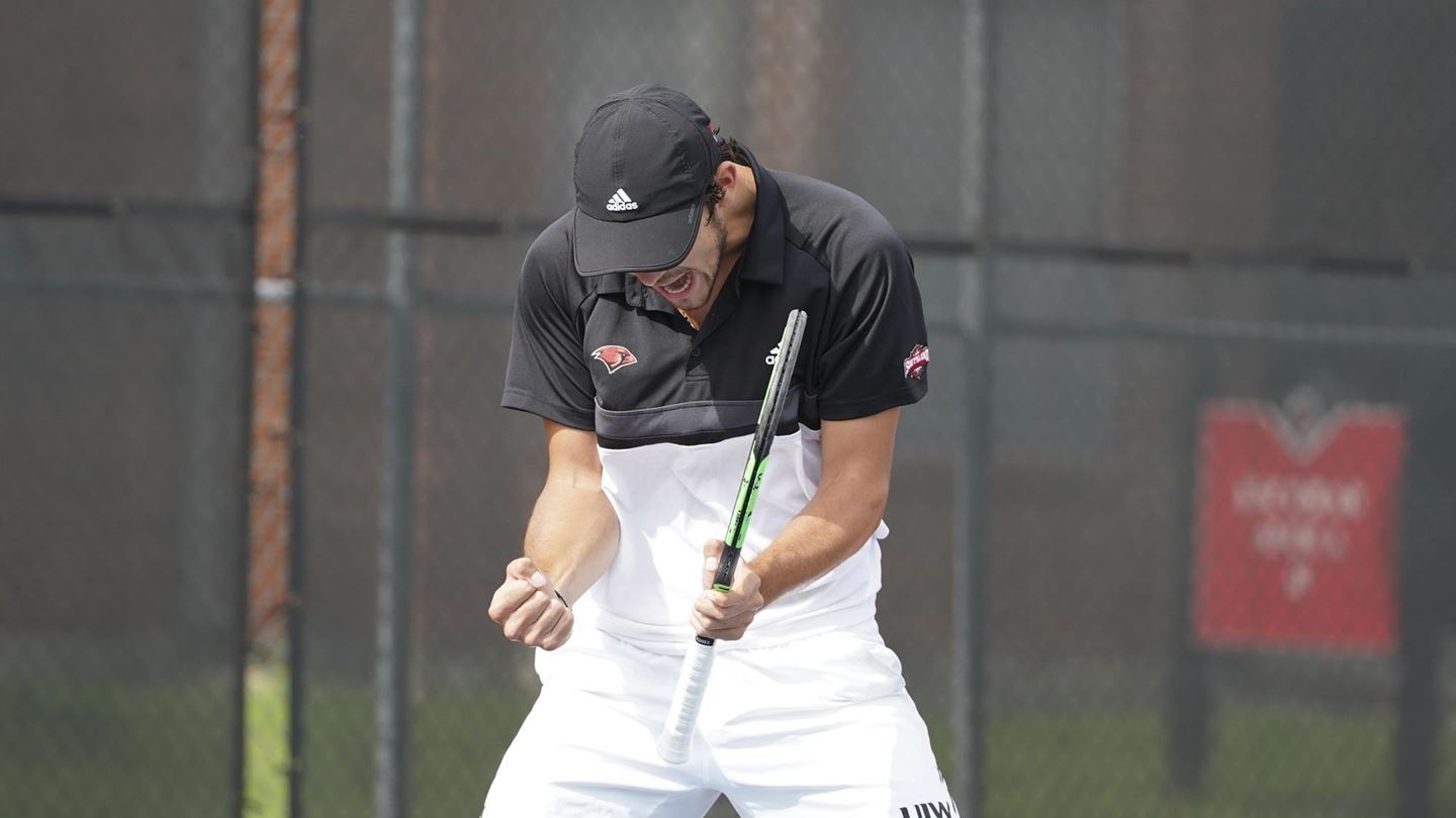 Men's tennis player celebrates win