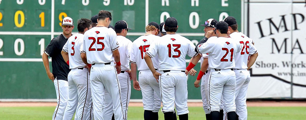 UIW baseball team gathers for a huddle on the baseball field