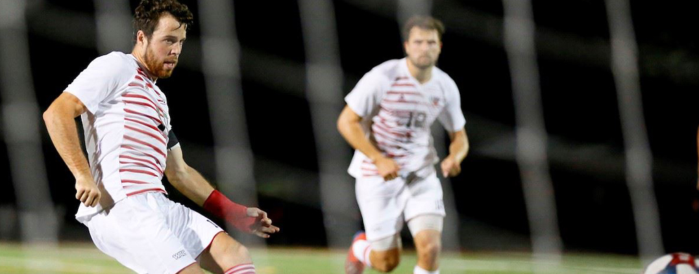 UIW men's soccer players run down the field