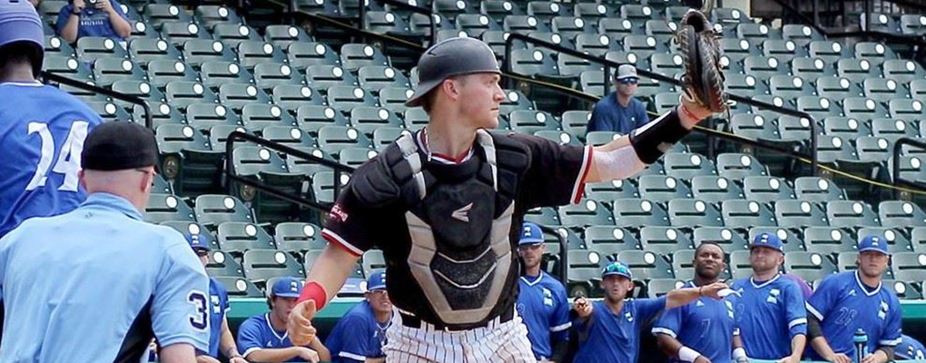 Taylor Smith warms up for a baseball game