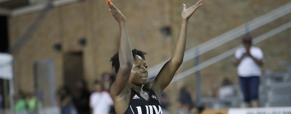 Sarea Alexander celebrates a successful jump on the track