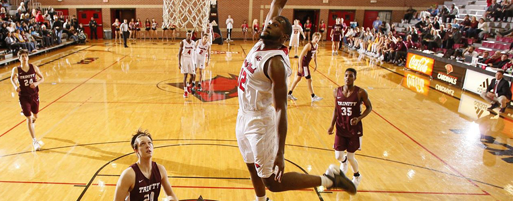 A UIW mens basketball player dunks a basketball