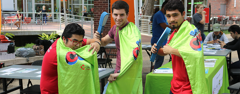 UIW students strike super hero poses wearing super hero capes at the team tony bone marrow drive