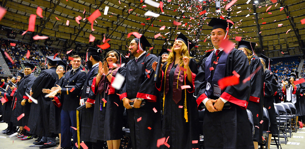 Confetti falls on smiling UIW graduates at their commencement ceremony