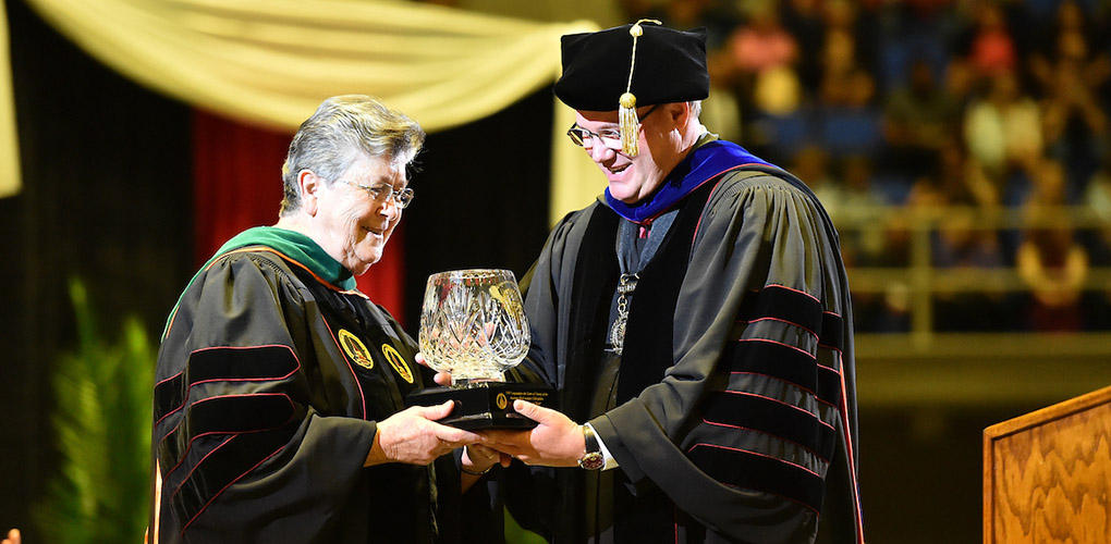 UIW President, Dr. Thomas Evans, presents a token of appreciation to the Sisters of Charity of the Incarnate Word at the 2019 spring commencement ceremony