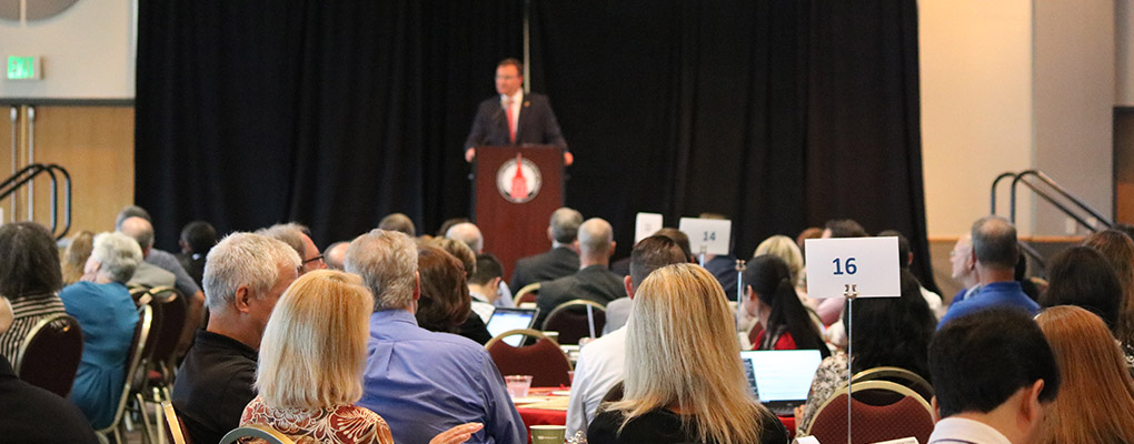 UIW faculty enjoy a meal as they listen to words from UIW President, Dr. Thomas Evans 