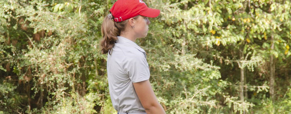 A UIW women's golf player looks down the golf course