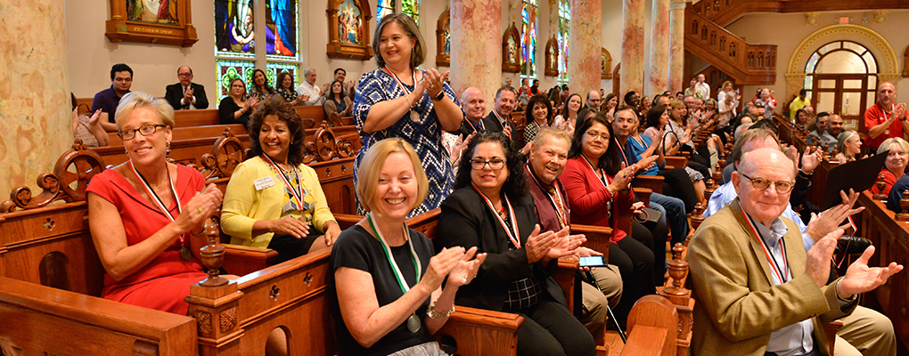 UIW employees cheer and applaud their coworkers