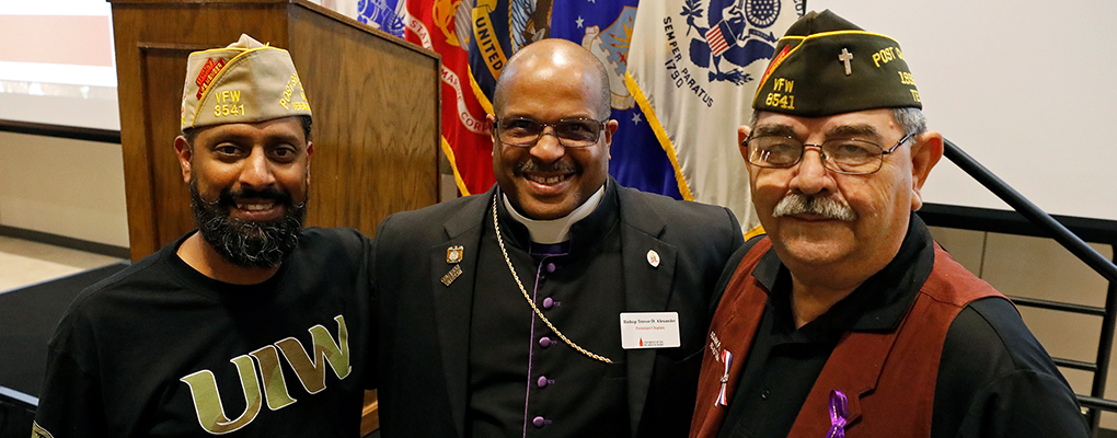 Three U.S. veterans pose for a photo together