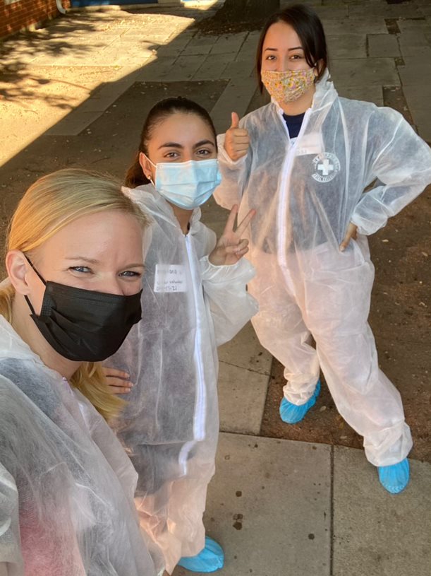 Students smiling in hazmat gear