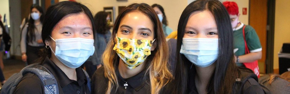 Three students with masks