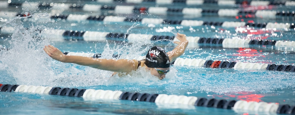A swimmer competes