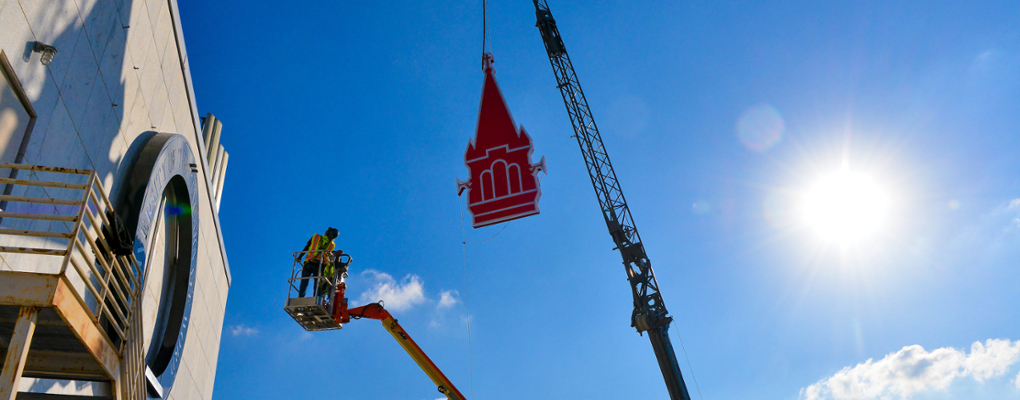 A steeple sign is installed on Founder's Hall