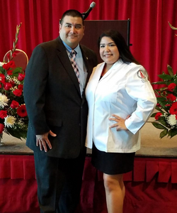 Dr. Alvarado stands with his wife