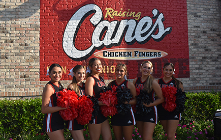 The Spirit team stands in front of the Raising Cane's building