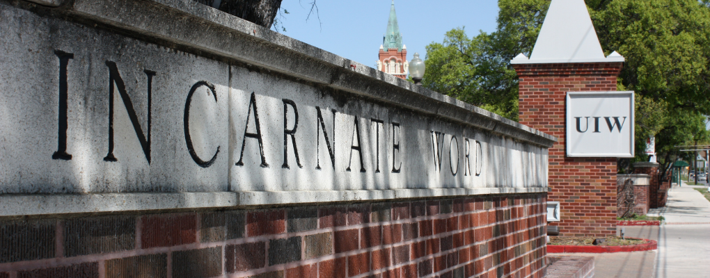 A brick wall that says "Incarnate Word"