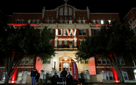 "UIW Homecoming" projected on the Administration Building