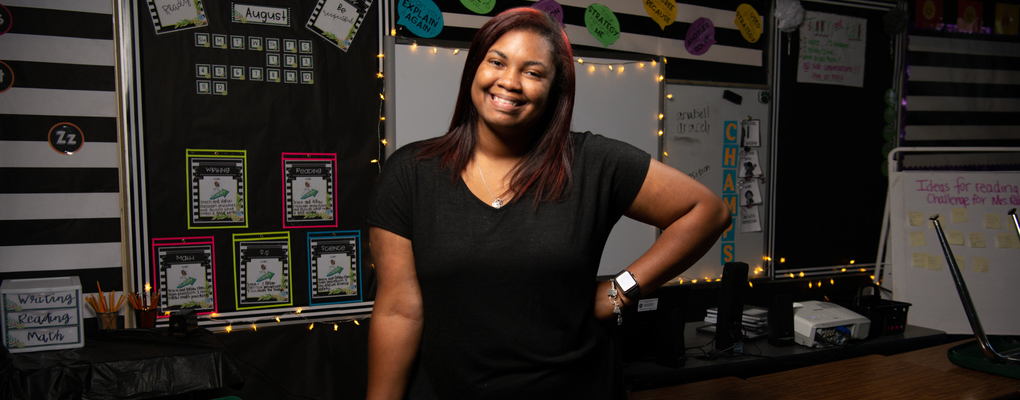 A UIW Education alumni poses for a photo in her classroom