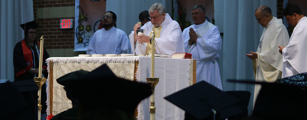 A priest prepares communion 