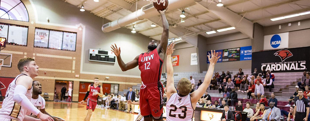 A UIW basketball player attempts to score
