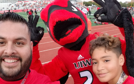 Christopher poses for a photo with Red the Cardinal