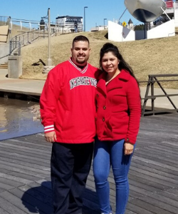 Chris poses for a photo with his wife