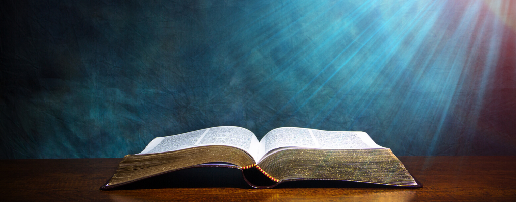 A Bible lays open on a table