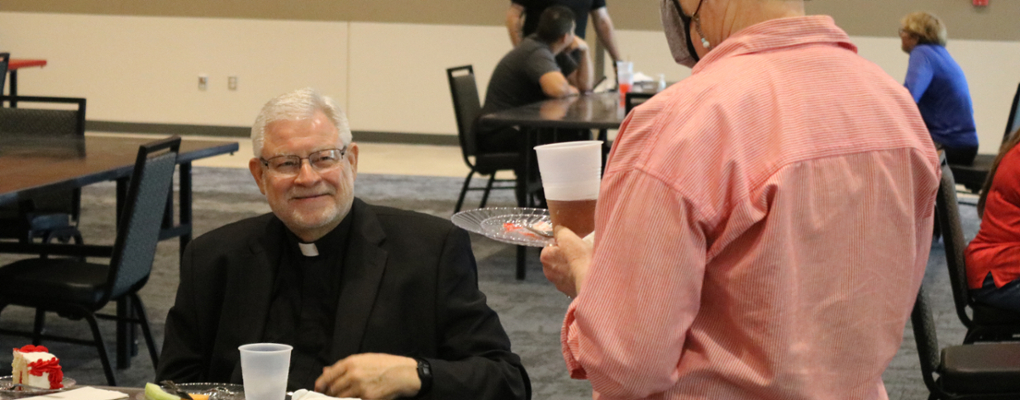Fr. Tom Dymowski looks up and smiles