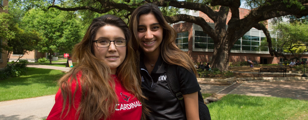 Two students pose for a photo together