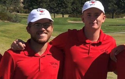 Golf team members pose for a photo together