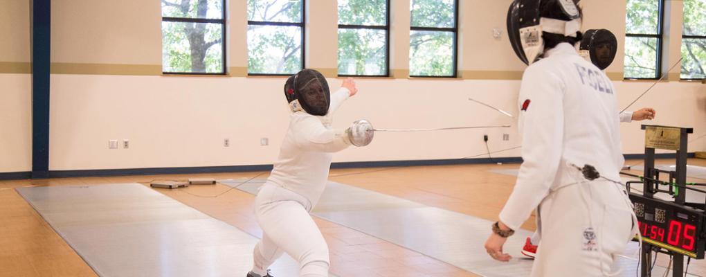 A fencing student in fencing uniform