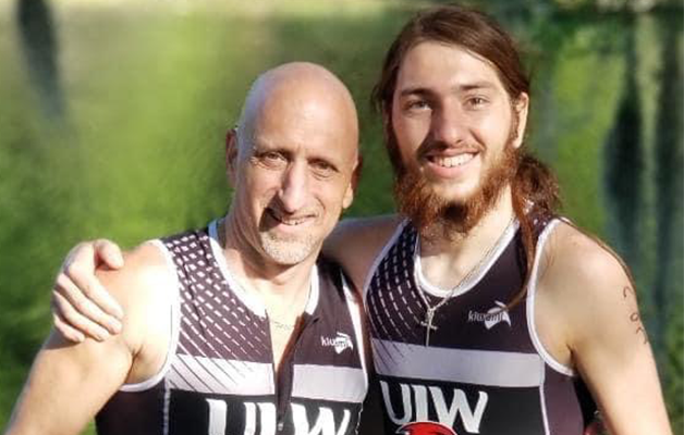 Nicholas LeBlanc places his arm around his father and they both smile for a photo