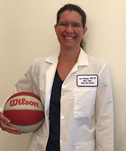 A nurse holds a basketball