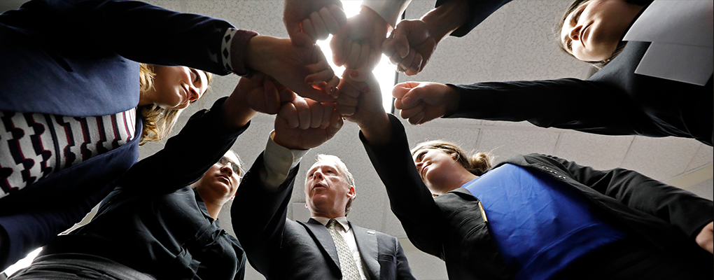 Dr. Vequist huddles with his students