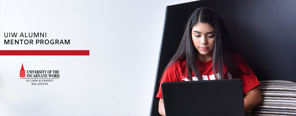 A student works on her laptop. Text on the image says "UIW Alumni Mentor Program"