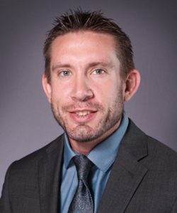 A headshot of Dr. Brandon Metroka