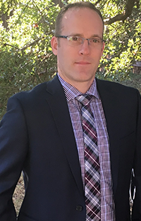 A headshot of Neil Schroeder