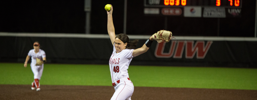 A UIW softball player pitches the ball