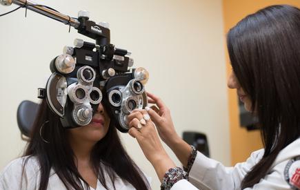 A woman receives an eye exam