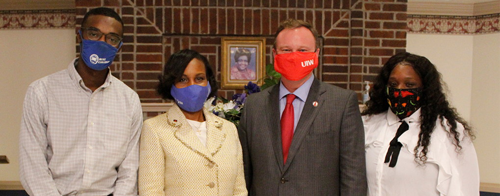 Dr. Evans, Ivy Taylor, and two students pose for a photo together