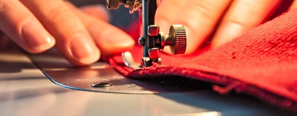 Hands working at a sewing machine
