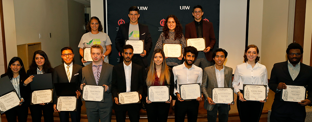 Startup Challenge participants pose for a photo holding certificates