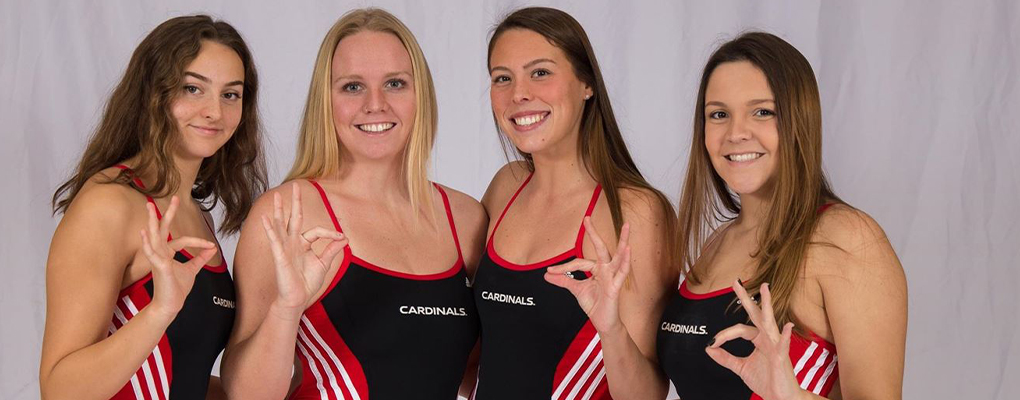 A group of swimmers pose for a photo together