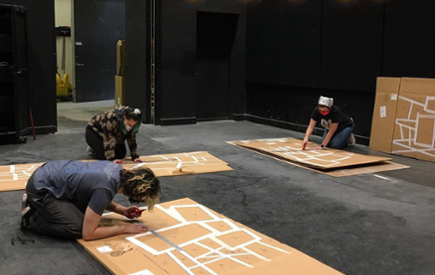 Theatre students build sets on stage