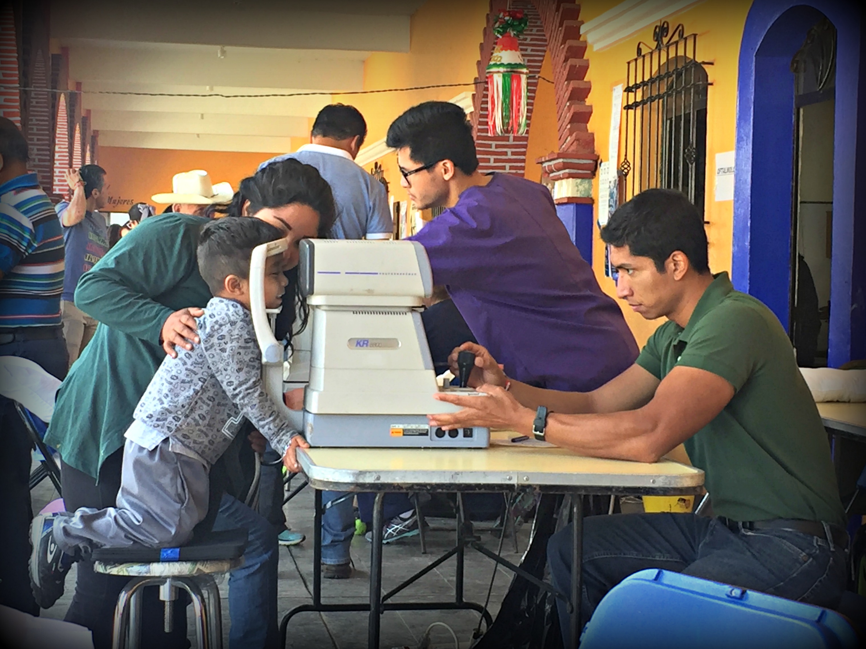 Pre-nursing student, Abel Puentes, assisted the UIW Optometry students with eye examination screenings using an autorefractor machine. This examination is used to create prescriptions for glasses.