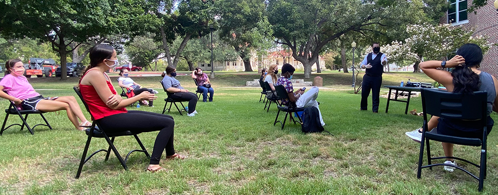 A magician puts on a magic show outdoors