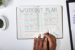 notebook with a workout plan